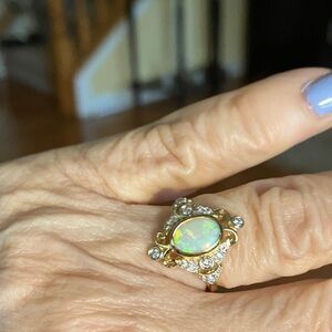 Opulent Gold Opal and 14k surrounded by diamonds brand new has never been worn